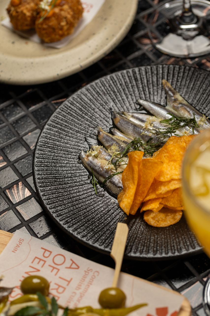 White Spanish anchovies cured in vinegar, served with potato crisps