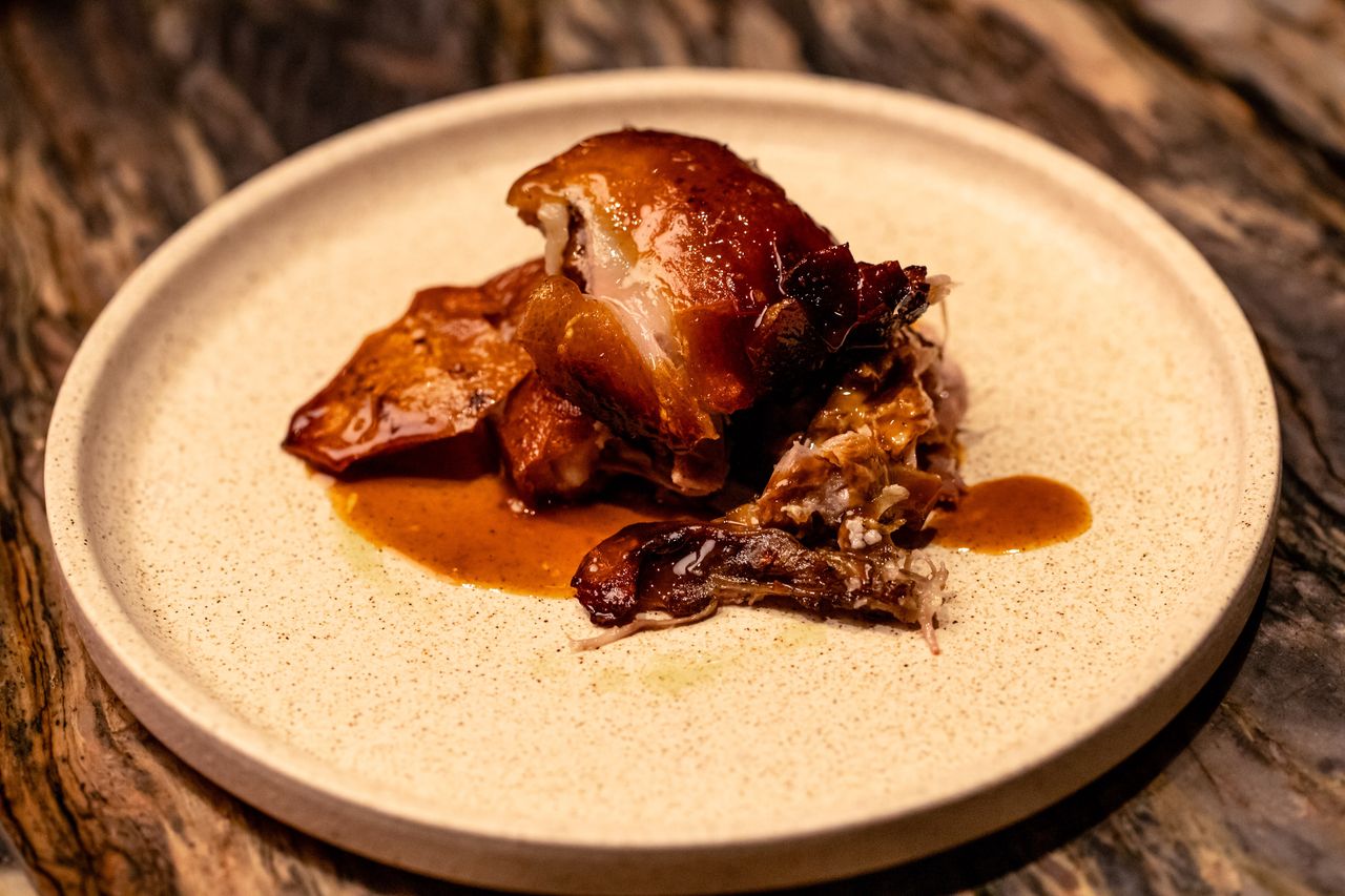 Portion of Segovian suckling pig with lacquered crackling skin